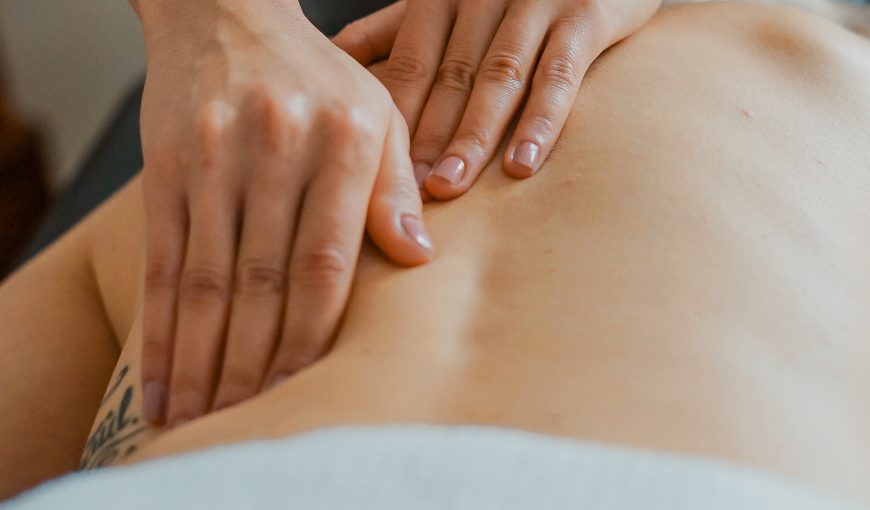 Close-up of massage hands on a client's back